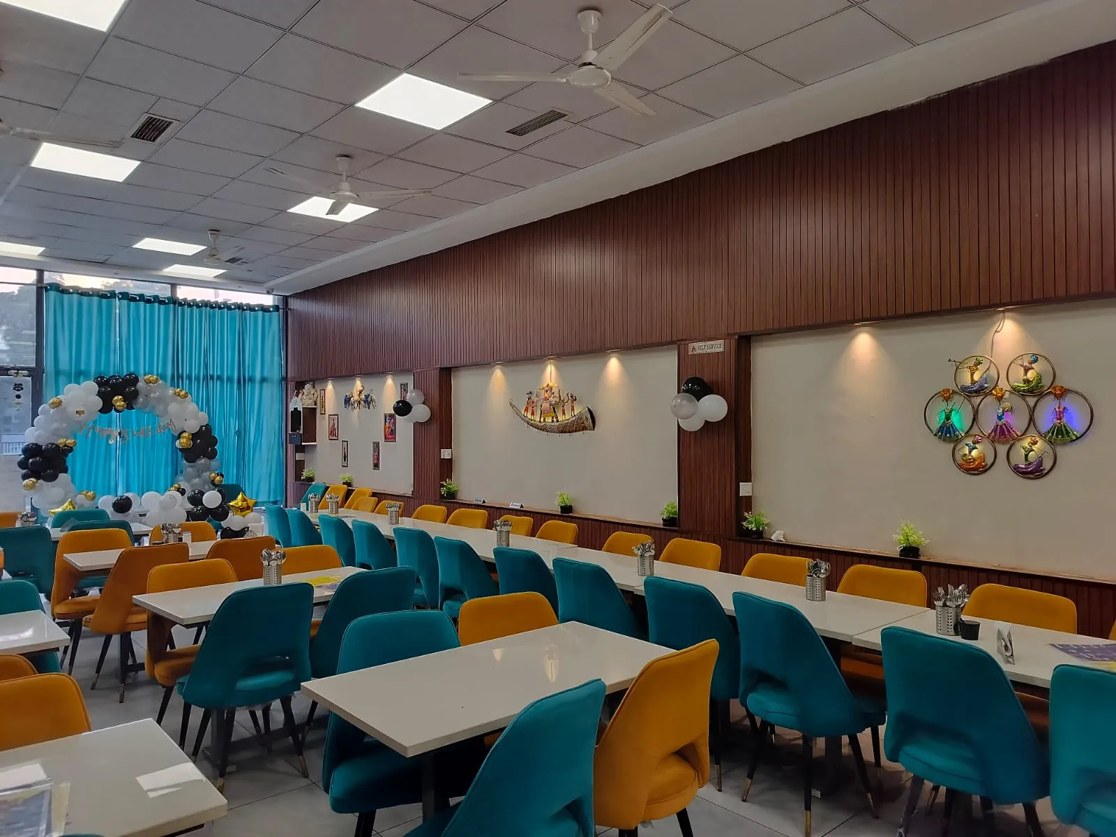 Spacious dining hall of Ganesham pure veg restaurant in Ujjain