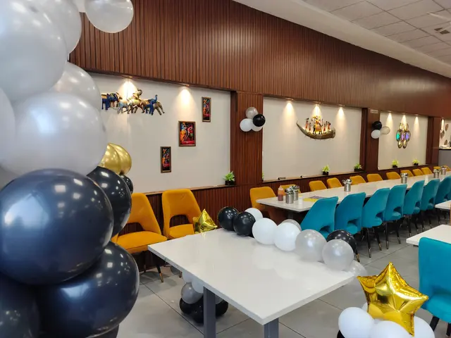 Kitty party seating decorated with balloons at Ganesham veg restaurant, Ujjain
